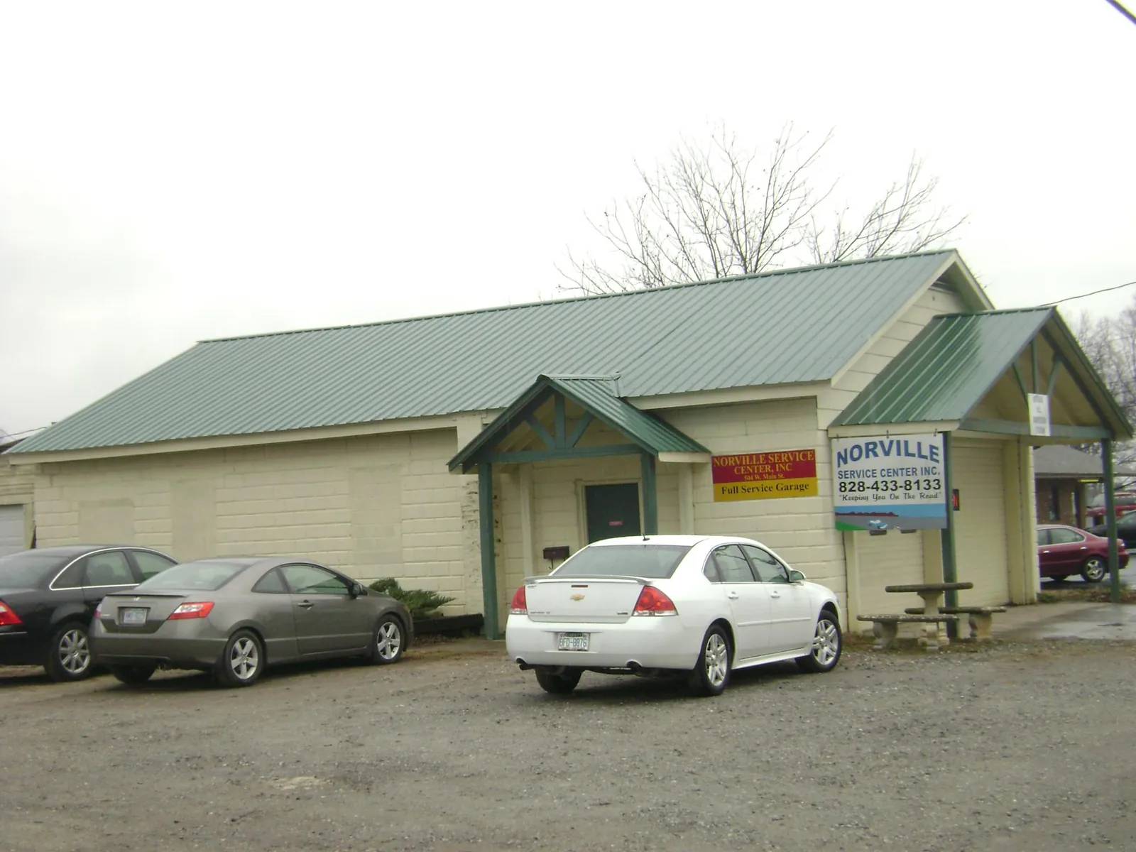 Green metal roof on a service garage with a covered entry in Brainerd
